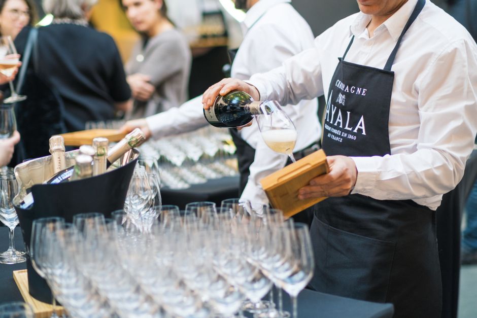 Professional event catering staff serving drinks
